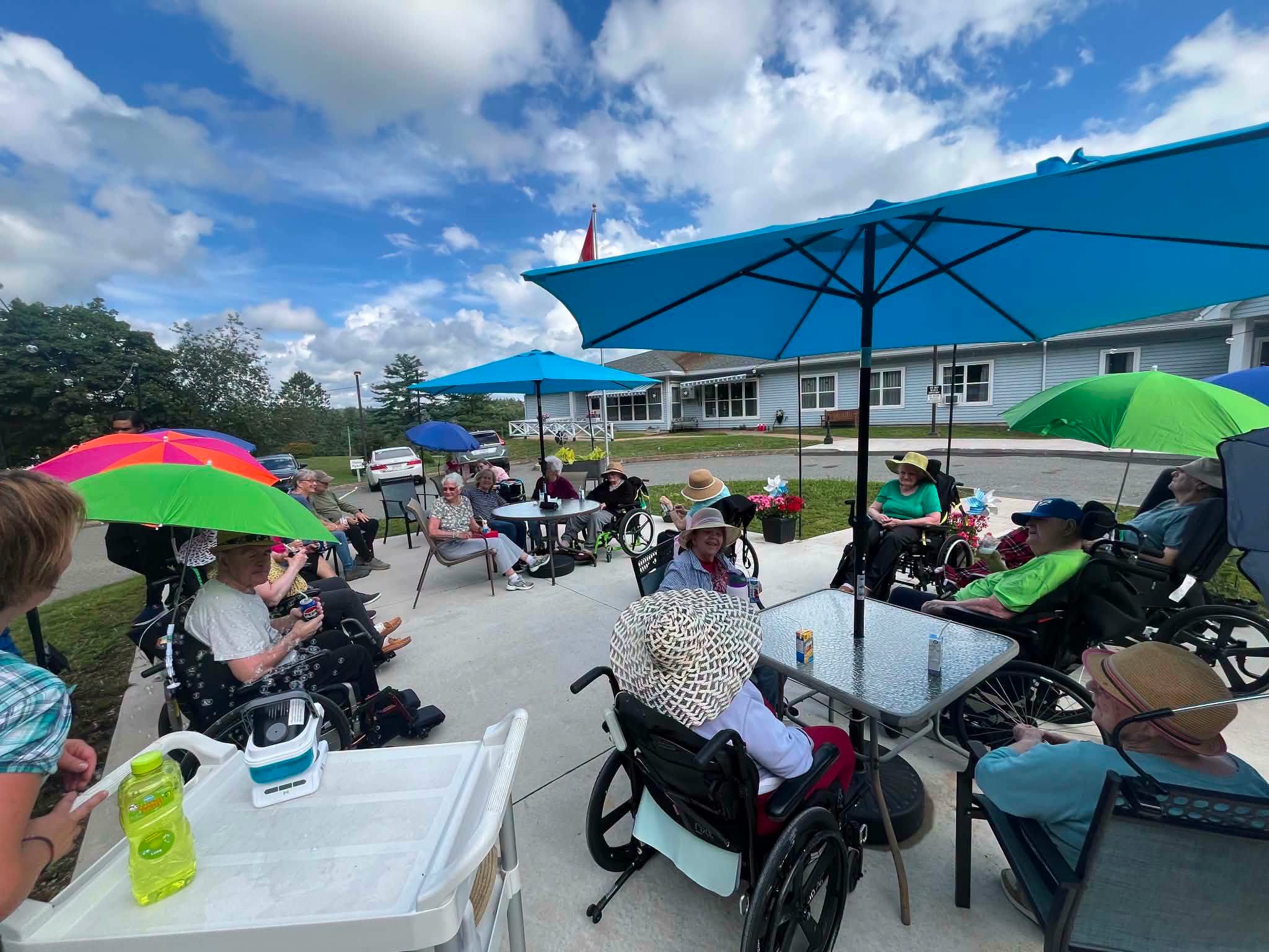Residents and staff enjoying sunny outdoors in Caledonia